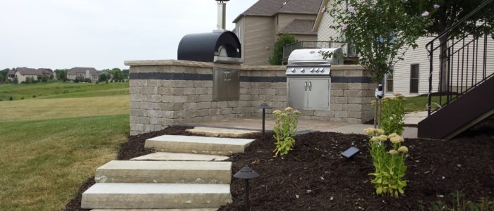 outdoor living grill area with stone steps