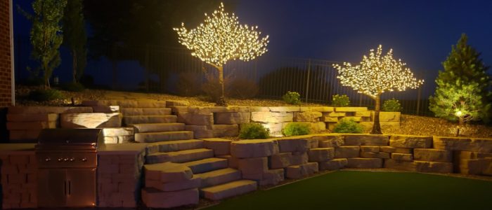 Landscaping with lighted LED trees by Outdoor Innovations.