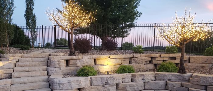 Landscaping with lighted LED trees by Outdoor Innovations.