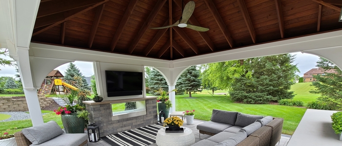 Inside a beautiful pavilion with entertaining area built by Outdoor Innovations.