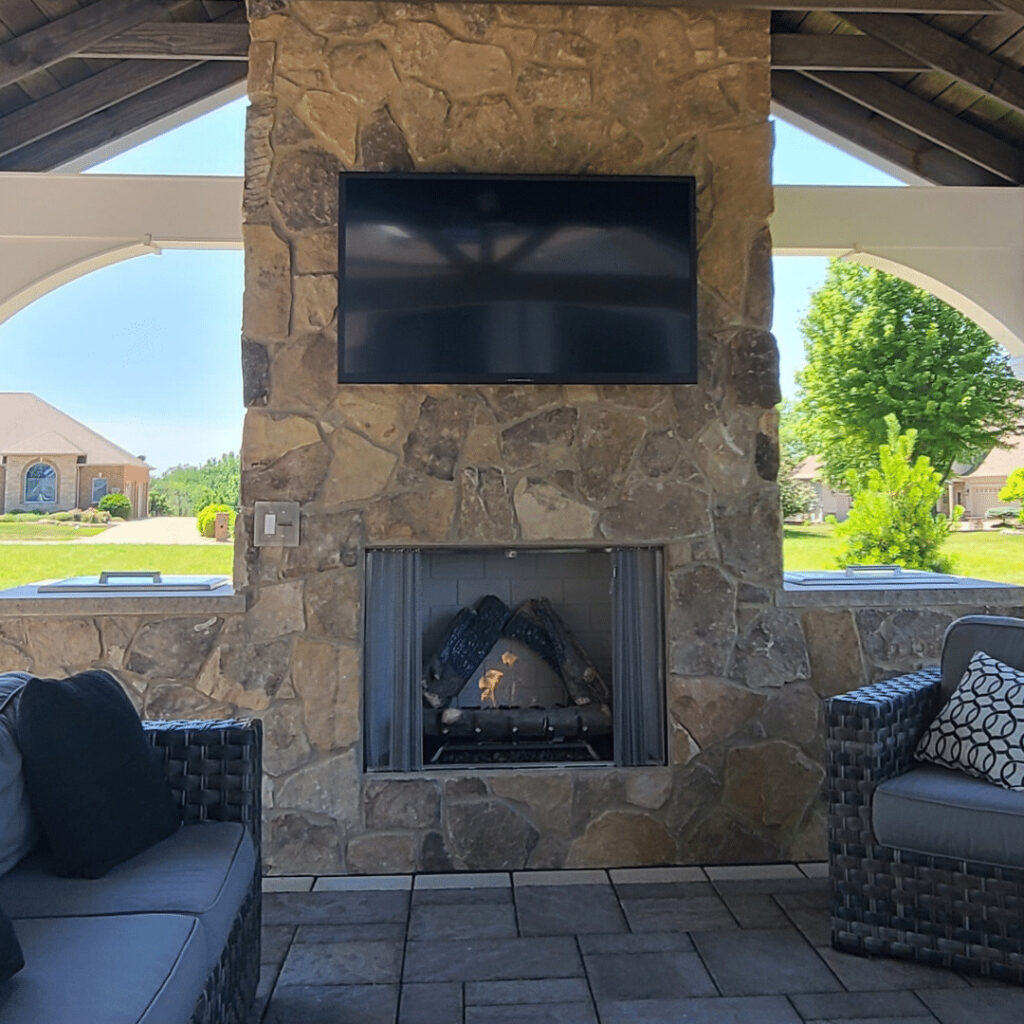 Fire features can both warm and add ambience to your outdoor entertainment area. 
