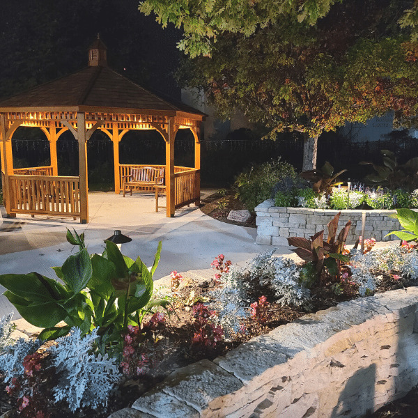 Outdoor LED lighting is energy efficient, as seen here with this well lit gazebo. 
