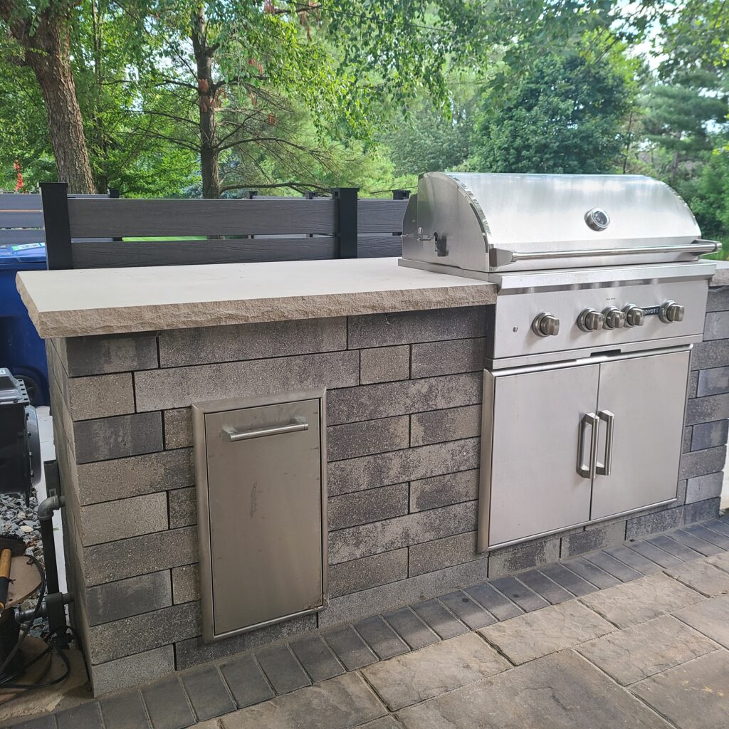 The grill island was a big part of this backyard transformation. 
