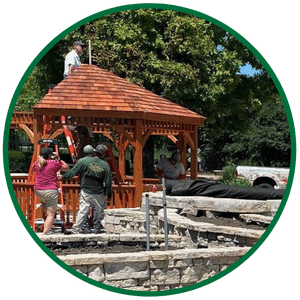 Having completed the gazebo design process, the team from Outdoor Innovations is installing this gazebo. 