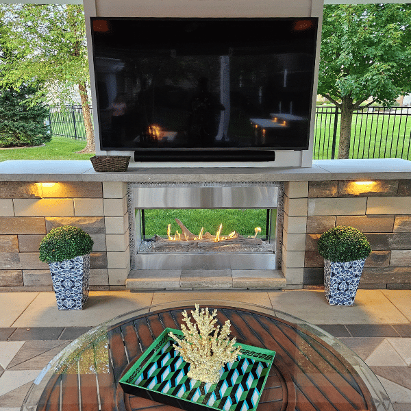 Entertaining outdoors in your pavilion can include a TV, gas fireplace, and cozy furniture. 