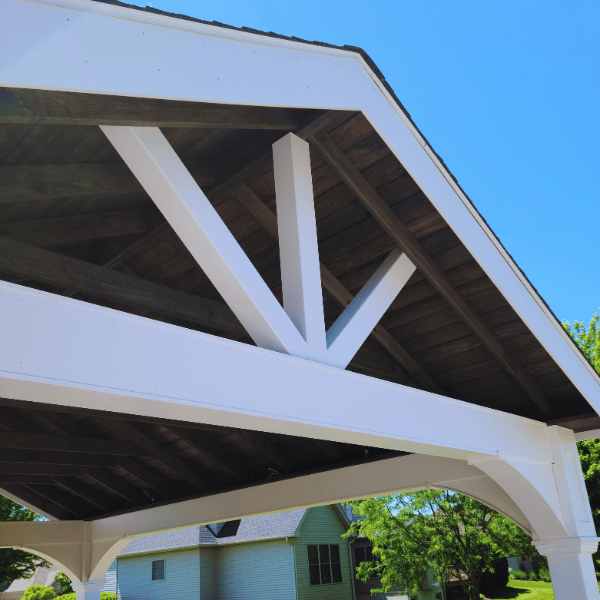 A close up view of a white vinyl Country Lane pavilion built by Outdoor Innovations. 