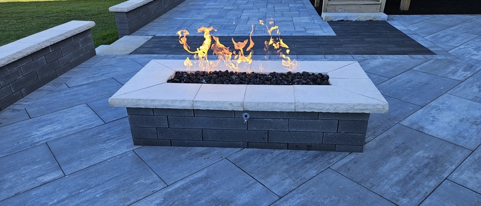 firepit Feiket Gas fire pit on custom stone patio.